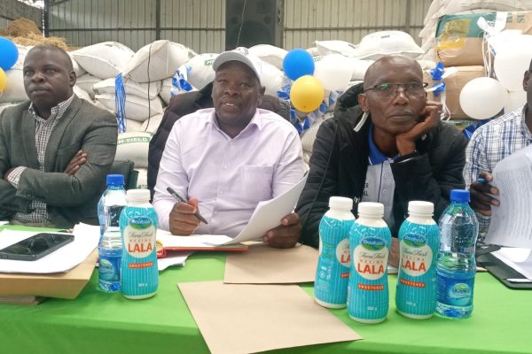 Molo Sub County Cooperative Officer Haron Muraya (centre)