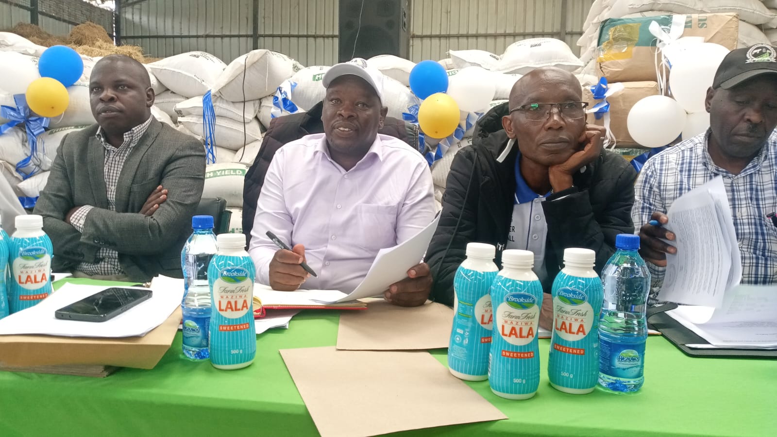 Molo Sub County Cooperative Officer Haron Muraya (centre)