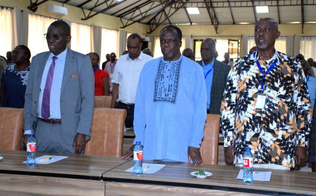 CS Cooperatives Wycliffe Oparanya ( C) with Commissioner for Cooperative David Obonyo ( l) during leadership forum in Naivasha.