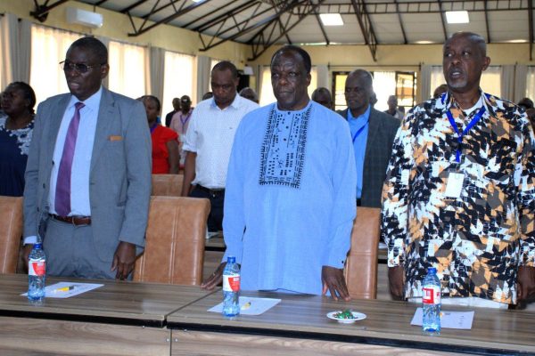 CS Cooperatives Wycliffe Oparanya ( C) with Commissioner for Cooperative David Obonyo ( l) during leadership forum in Naivasha.