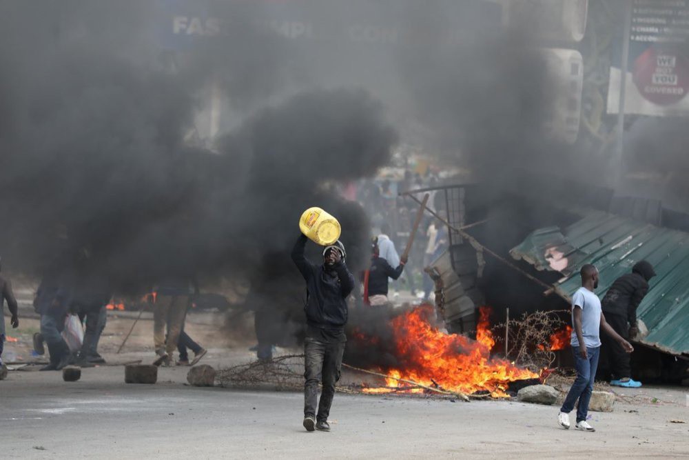 A protester carrying empty jerry can during the ongoing matatu strike